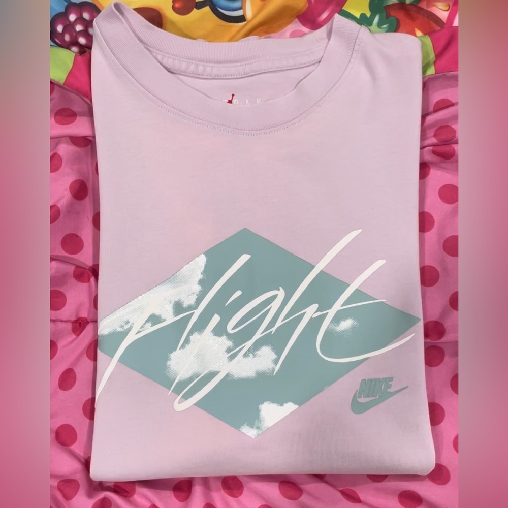 2 T-shirts, one Calvin Klein and one Nike.